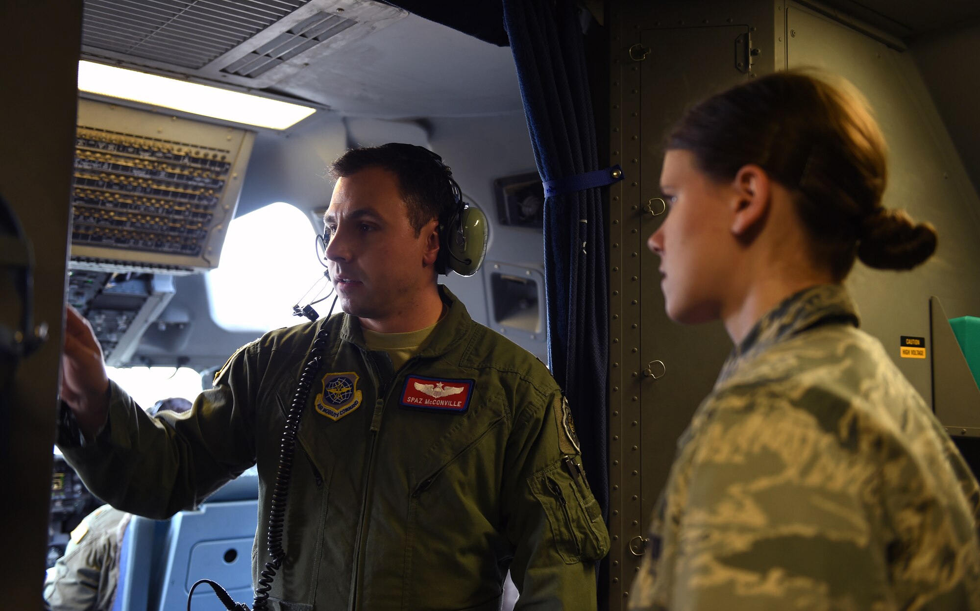 Maj. Sean McConville (left), 62nd Airlift Wing tactics officer, speaks to 1st. Lt. Christy Vachavake, 62nd Operation Support Squadron chief of Intel training, prior to their departure May 17, 2016 from Joint Base Lewis-McChord, Wash. This was the first time a McChord intelligence unit utilized their Global Rapid Response Intelligence Package in a training scenario. (U.S. Air Force photo/Staff Sgt. Naomi Shipley) 