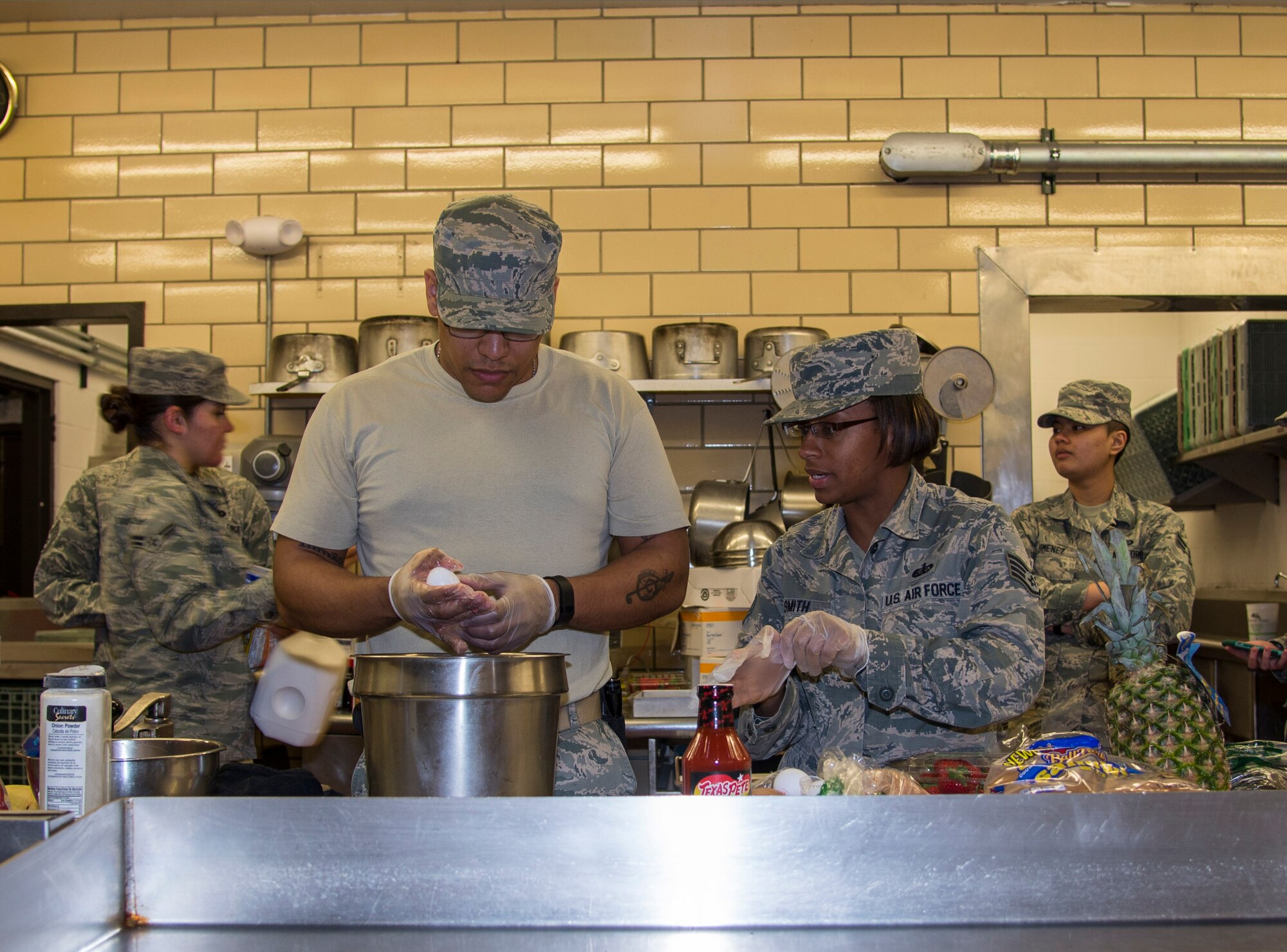 Members of the 5th Force Support Squadron prepare their dishes for the top chef competition at Minot Air Force Base, N.D., May 17, 2016. Three teams consisting of Minot chefs and at least one missile chef competed to go to Barksdale AFB, L.A. for the Global Strike Competition. (U.S. Air Force photo/Airman 1st Class Christian Sullivan) 