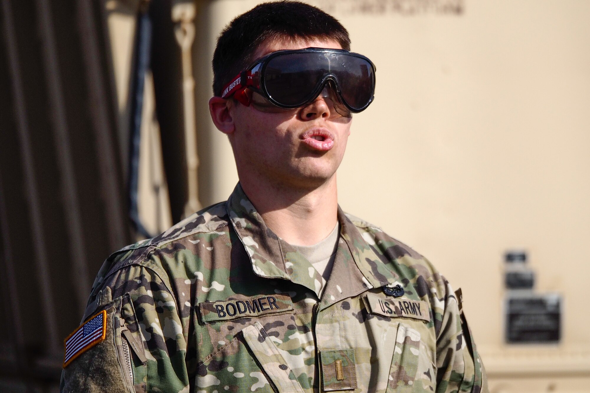 Army 2nd Lt. Jacob Bodmer, assigned to the 17th Combat Sustainment Support Battalion, U.S. Army Alaska, takes a deep breath before playing a game of catch with a fellow soldier while wearing goggles that simulate visual impairment under the influence of alcohol during a unit Safety Stand-Down Day, Friday, May 13, 2016. During the event Soldiers were trained at different stations in fire prevention, personal weapons safety, outdoor recreation safety, family and personal health, and Driving Under the Influence prevention. (U.S. Air Force photo by Justin Connaher)