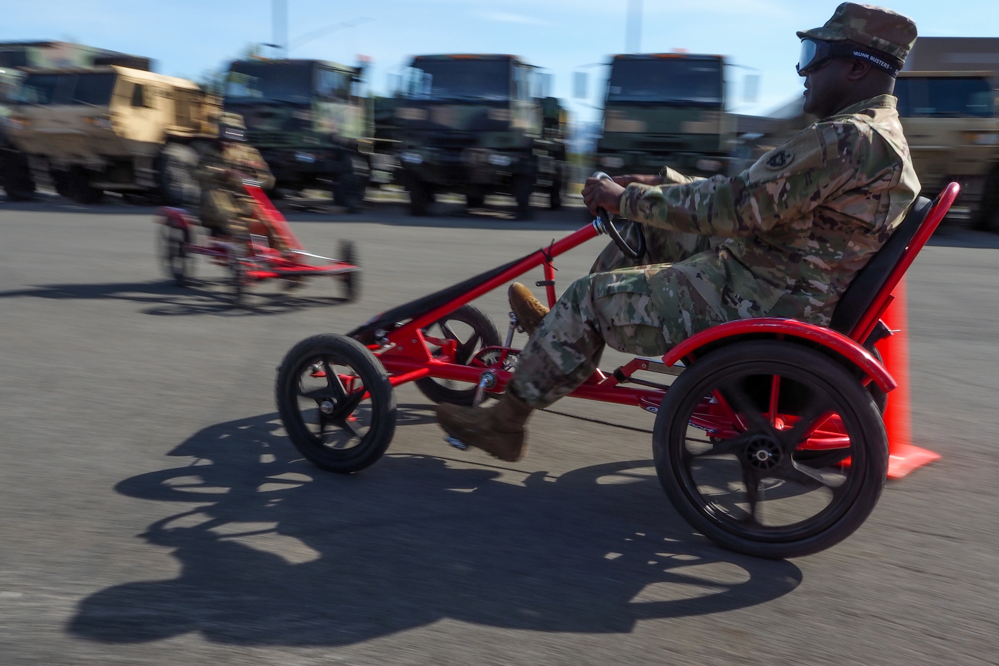 Army Staff Sgt. Anthony Hasberry, a native of Selma, Ala., assigned to the 17th Combat Sustainment Support Battalion, U.S. Army Alaska, negotiates a driving obstacle course while wearing goggles that simulate visual impairment under the influence of alcohol during a unit Safety Stand-Down Day, Friday, May 13, 2016. During the event Soldiers were trained at different stations in fire prevention, personal weapons safety, outdoor recreation safety, family and personal health, and Driving Under the Influence prevention. (U.S. Air Force photo/Justin Connaher)