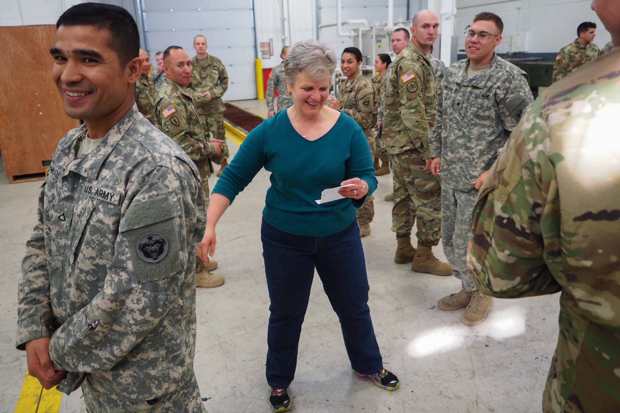 Army Pfc. Sunil Adhikari, assigned to the 17th Combat Sustainment Support Battalion, U.S. Army Alaska, laughs as Lisa Schuette, the health promotion coordinator for Joint Base Elmendorf-Richardson, Alaska, conducts an excercise in healthy eating habits during a unit Safety Stand-Down Day, Friday, May 13, 2016. The Soldiers were trained at different stations in fire prevention, personal weapons safety, outdoor recreation safety, family and personal health, and Driving Under the Influence prevention. (U.S. Air Force photo/Justin Connaher)
