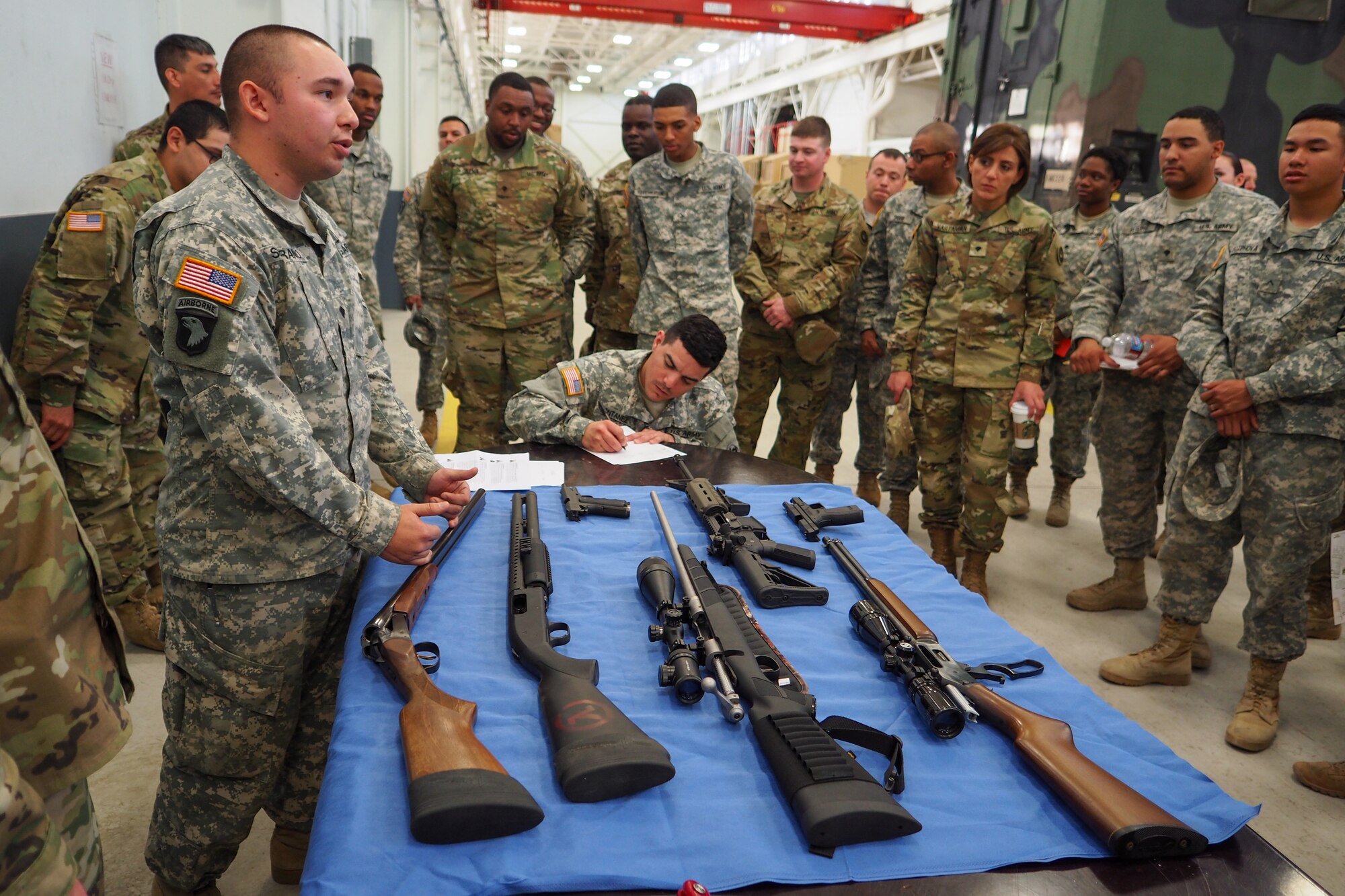 Spc. Dillon Serrano, a native of  Ada, Okla., assigned to the 17th Combat Sustainment Support Battalion, U.S. Army Alaska, conducts a briefing on the safe use of personal weapons during a unit Safety Stand-Down Day, Friday, May 13, 2016. The Soldiers were trained at different stations in fire prevention, personal weapons safety, outdoor recreation safety, family and personal health, and Driving Under the Influence prevention. (U.S. Air Force photo/Justin Connaher)
