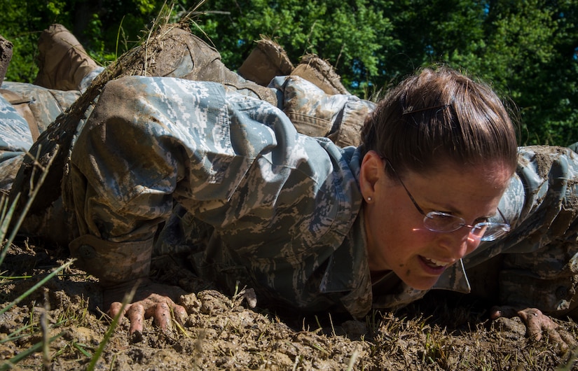 Lt. Col. Sarah Isbill, 811th Security Forces Squadron commander, participates in a challenge at the 14 Defender Challenge on Joint Base Andrews, Md., May 20, 2016. The event included 14 challenges, which paid tribute to the 14 security forces members lost in combat since 9/11. (U.S. Air Force photo by Senior Airman Mariah Haddenham/Released