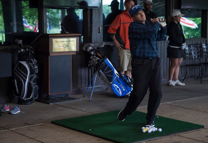 Gen. David Goldfein, U.S. Air Force Vice Chief of Staff, practices his swing before golfing with Members of the Ladies Professional Golf Association on Joint Base Andrews, Md., May 20, 2016. The ladies toured the base, then held lessons at The Courses at Andrews. (U.S. Air Force photo by Senior Airman Mariah Haddenham/Released)