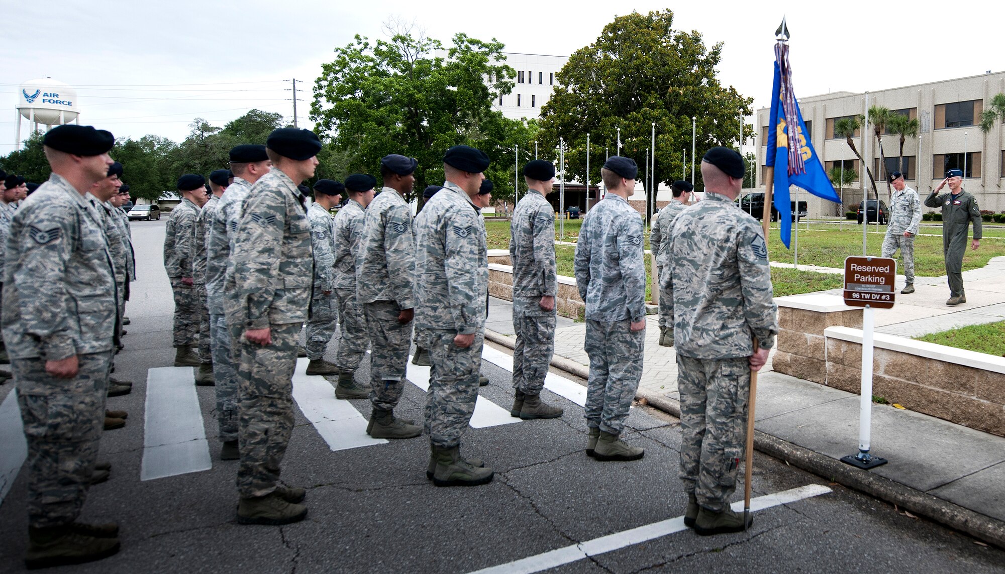 Brig. Gen. Christopher Azzano, 96th Test Wing commander, salutes a flight of 96th Security Forces Squadron Airmen after a retreat ceremony May 20 at Eglin Air Force Base, Fla.  The security forces-lead ceremony wrapped up the squadron’s National Police Week activities.  (U.S. Air Force photo/Samuel King Jr.)
