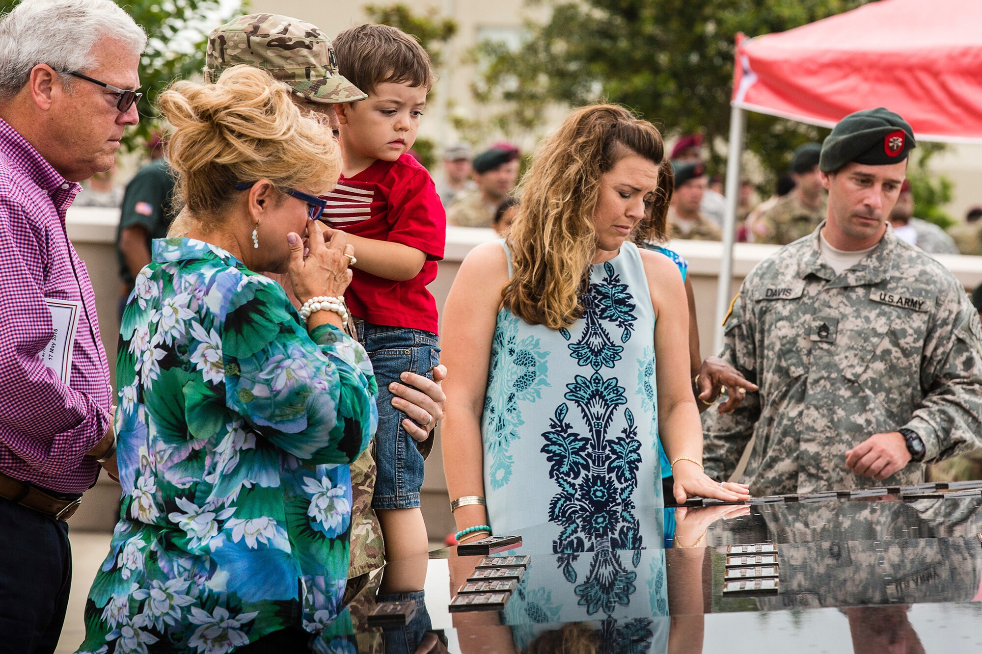 Gold Star family members view the placards containing the names of the fallen during the 7th Special Forces Group (Airborne) memorial wall dedication ceremony held on Eglin Air Force Base Fla, May 17. (U.S. Army photo by Staff Sgt. Bryan Henson)