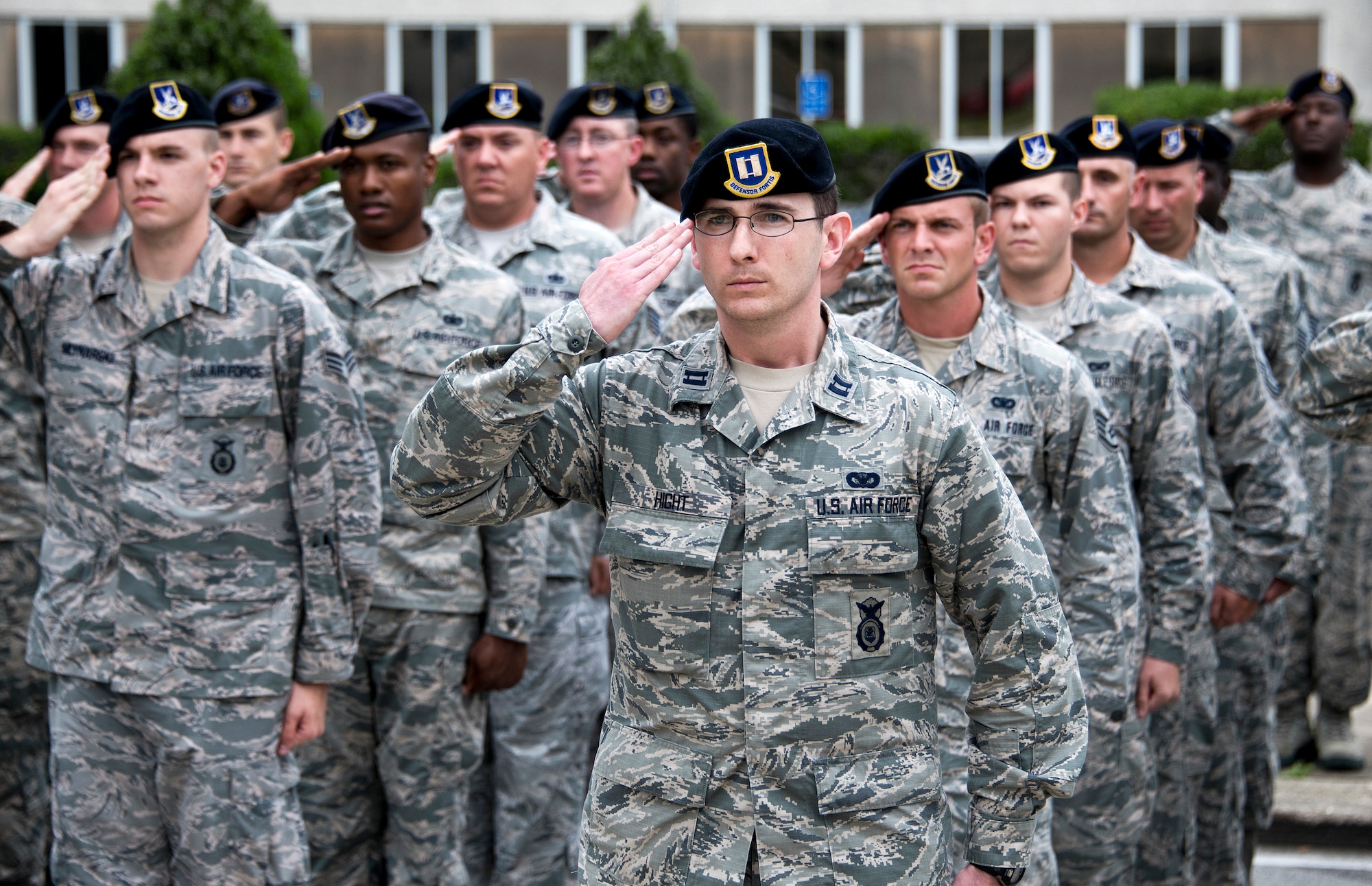 Capt. Joshua Hight leads a formation of 96th Security Forces Squadron Airmen in a salute during the National Anthem at the retreat ceremony May 20 at Eglin Air Force Base, Fla.  The security forces-lead ceremony wrapped up the squadron’s National Police Week activities.  (U.S. Air Force photo/Samuel King Jr.)