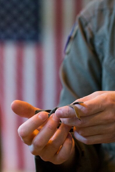 Staff Sgt. Joel Powell, 374th Operations Support Squadron joint airdrop inspector, demonstrates rope work during joint airdrop inspection familiarization for Japan Air Self-Defense Force loadmasters with the 401st Squadron at Yokota Air Base, Japan, May 18. Members with the JASDF familiarized with JAI procedures to prepare for heavy equipment and high-velocity container delivery systems during the upcoming Red-Flag Alaska. (U.S. Air Force photo by Yasuo Osakabe/Released)  