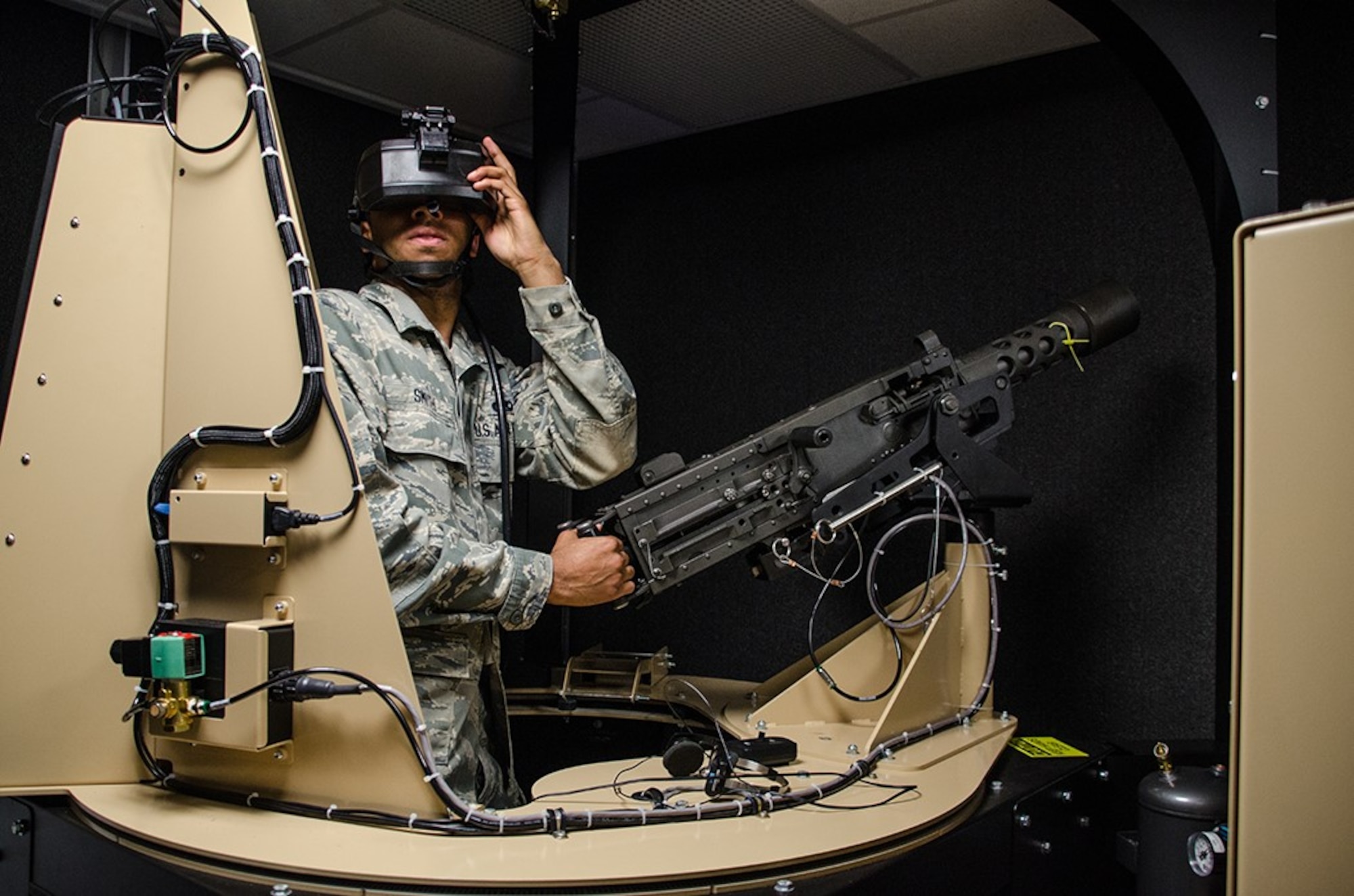 Senior Airman Westley Smith, a weapons loader with the 131st Bomb Wing, participates in a virtual-reality gunner station during Annual Training at Camp Clark, Missouri, on May 18, 2016. The simulation is part of the Virtual Clearance Training Suite that helps train Airmen on real-life scenarios.