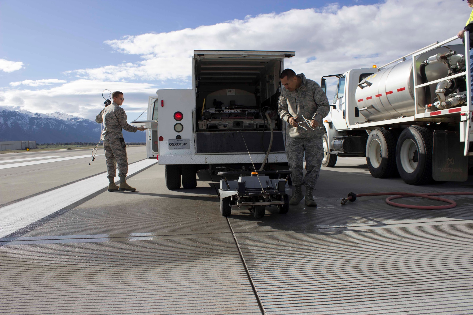 Capt. Andrew Jouben, chief of the Air Force Civil Engineer Center Airfield Pavement Evaluation, or APE, Team and Master Sgt. Robinson Hidalgo, superintendent of the AFCEC APE Team, wrap up a friction test on the runway at Hill AFB, Utah.