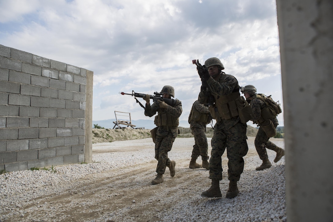 Reserve Marines with 4th Law Enforcement Battalion, Force Headquarters Group, Marine Forces Reserve, practice clearing a house during exercise Platinum Wolf 2016 at Peacekeeping Operations Training Center South Base, Bujanovac, Serbia, May 118, 2016. The Marines are working with the partner nations of Bosnia, Bulgaria, Macedonia, Montenegro, Slovenia and Serbia to share new ideas, build interoperability, and master peacekeeping operations.