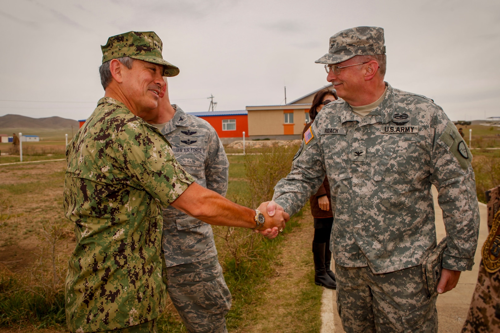 U.S. Navy Adm. Harry B. Harris, commander, U.S. Pacific Command, greets U.S. Army Col. Jeffrey Roach, commander, 38th Troop Command, before the Khaan Quest 2016 opening ceremony at the Five Hills Training Area, Mongolia, May 22, 2016. Khaan Quest is an annual, multinational peacekeeping operations exercise conducted in Mongolia and is the capstone exercise for this year's United Nations Global Peace Operations Initiative program. 