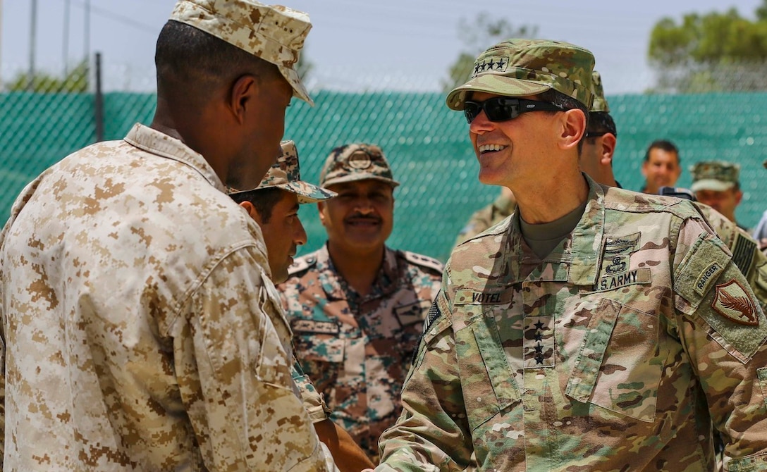 U.S. Army Gen. Joseph Votel Commander of U.S. Central Command, meets with U.S. Marine Sgt. Maj. Clifford Wiggins, 5th Marine Expeditionary Brigade, and members of the Jordanian Armed Forces during Exercise Eager Lion 16 near Amman, Jordan on May 22, 2016.