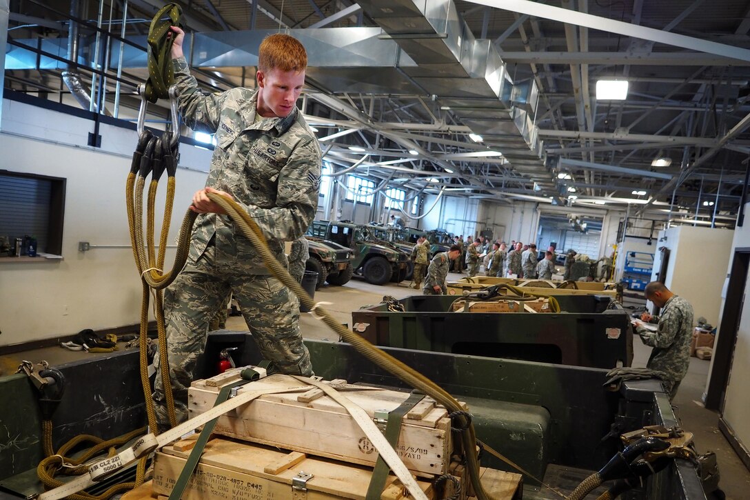 Air Force Senior Airman Jacob Hodney participates in slingload training taught by U.S. Army Pathfinder School instructors at Joint Base Elmendorf-Richardson, Alaska, May 18, 2016. Hodney is assigned to the 25th Air Support Operations Squadron. Pathfinders specialize in navigating through foreign terrain and establishing safe landing zones for airborne and air assault soldiers or Army aircraft. Air Force photo by Justin Connaher