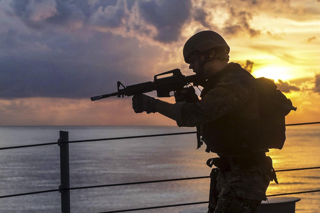 A sailor trains aboard the USS William P. Lawrence in the South China Sea, May 17, 2016. The guided-missile destroyer is operating as part of the John C. Stennis Strike Group and Great Green Fleet on a regularly scheduled 7th Fleet deployment. The sailor is assigned to the assigned to the visit, board, search and seizure team. Navy photo by Petty Officer 3rd Class Emiline L. M. Senn