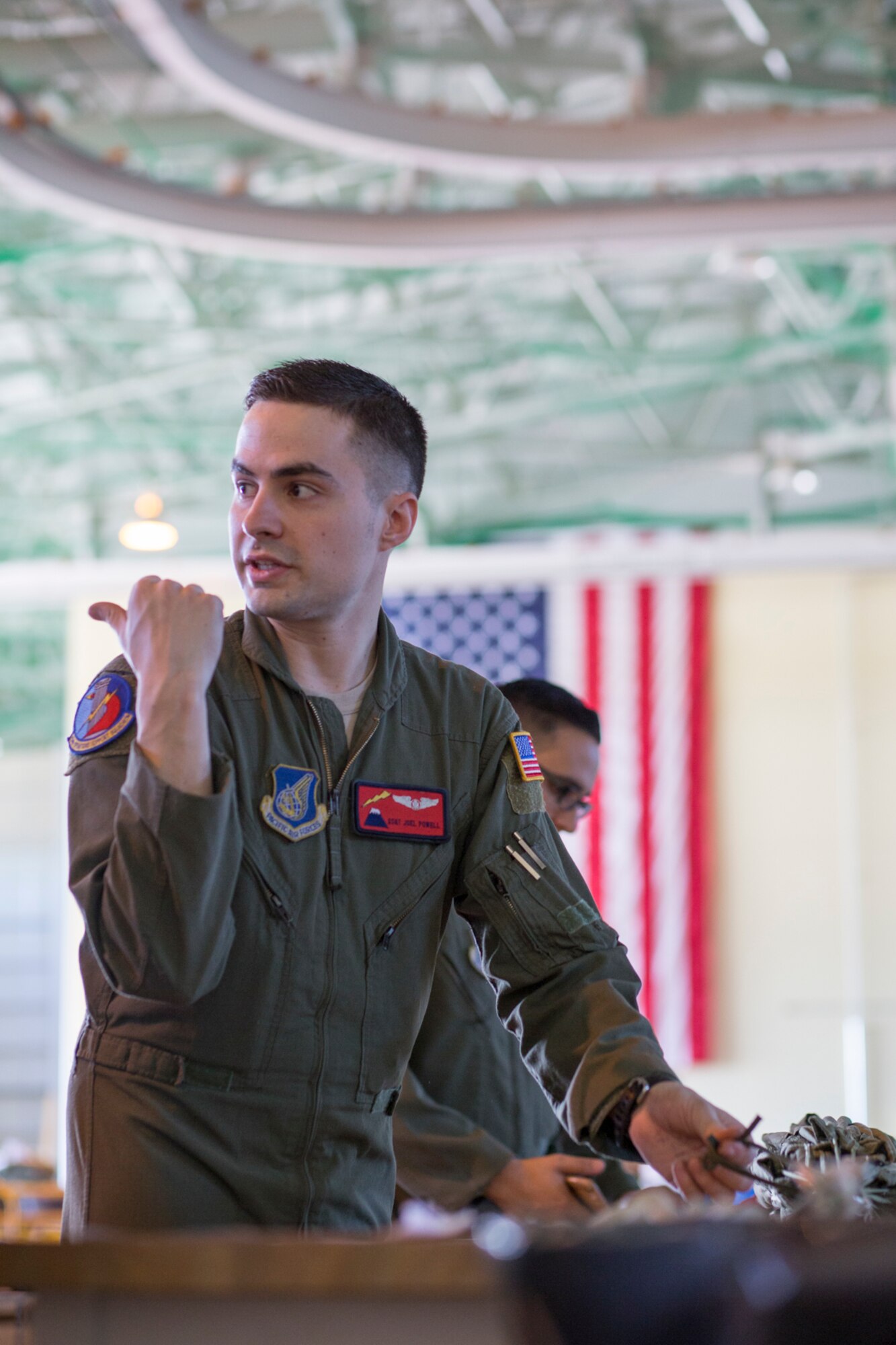 Staff Sgt. Joel Powell, 374th Operations Support Squadron joint airdrop inspector, demonstrates joint airdrop inspection procedures to Japan Air Self-Defense Force loadmasters with the 401st Squadron at Yokota Air Base, Japan, May 18, 2016. Members of JASDF familiarized with JAI procedures in preparation to drop USAF’s heavy equipment and high-velocity container delivery systems during exercise Red-Flag Alaska. (U.S. Air Force photo by Yasuo Osakabe/Released)