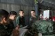 U.S. Air Force Staff Sgt. Joel Powell, 374th Operations Support Squadron joint airdrop inspector, shows a joint airdrop inspection checklist to Japan Air Self-Defense Force members at Yokota Air Base, Japan, May 18, 2016. Members of JASDF familiarized with JAI procedures in preparation to drop USAF’s heavy equipment and high-velocity container delivery systems during exercise Red-Flag Alaska. (U.S. Air Force photo by Yasuo Osakabe/Released)