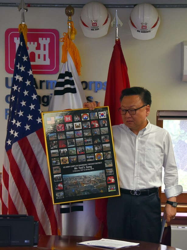 Ted Song was bid a fond farewell at the Far East District headquarters on May 24, 2016. Col. Stephen Bales, FED commander, presented him with an award, and the section he was leaving, PPMD, also presented him with a gift card and a framed display showing projects he'd worked on while assigned here.