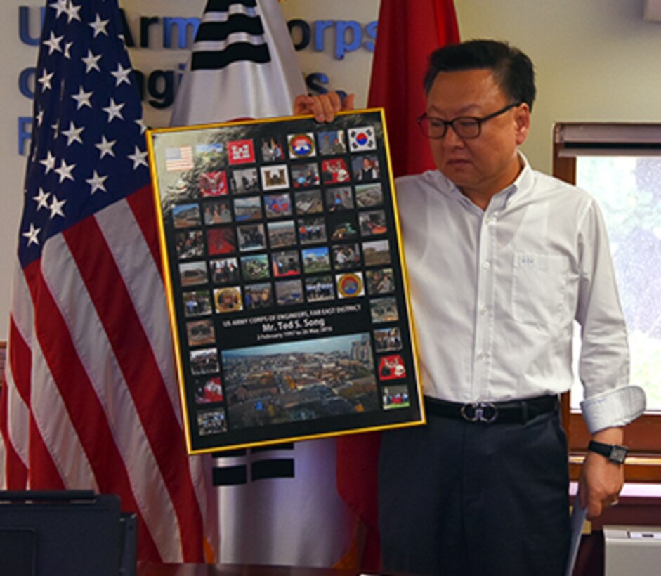 Ted Song was bid a fond farewell at the Far East District headquarters on May 24, 2016. Col. Stephen Bales, FED commander, presented him with an award, and the section he was leaving, PPMD, also presented him with a gift card and a framed display showing projects he'd worked on while assigned here.
