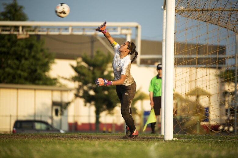 Sarah Cronin, goalkeeper and center midfielder from the Panthers girls’ soccer team from Yokota High School, blocks a shot at the goal during the last part of the championship game in the Far East Soccer Tournament hosted by Matthew C. Perry High School at Marine Corps Air Station Iwakuni, Japan, May 19, 2016. The Far East Soccer Tournament is the largest soccer event that Department of Defense Education Activity Schools Pacific in Japan, Korea and International Schools have to look forward to compete in all season. (U.S. Marine Corps photo by Lance Cpl. Donato Maffin/Released)