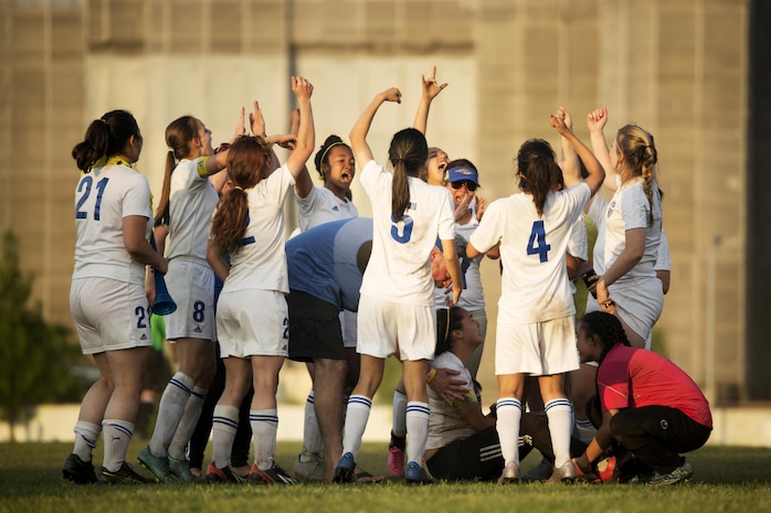 Members of the Panthers girls’ soccer team from Yokota High School, take a moment to celebrate after winning first place in the Far East Soccer Tournament hosted by Matthew C. Perry High School at Marine Corps Air Station Iwakuni May 19, 2016. The Far East Soccer Tournament is the largest soccer event that Department of Defense Education Activity Schools Pacific in Japan, Korea and International Schools have to look forward to compete in all season. (U.S. Marine Corps photo by Lance Cpl. Donato Maffin/Released)