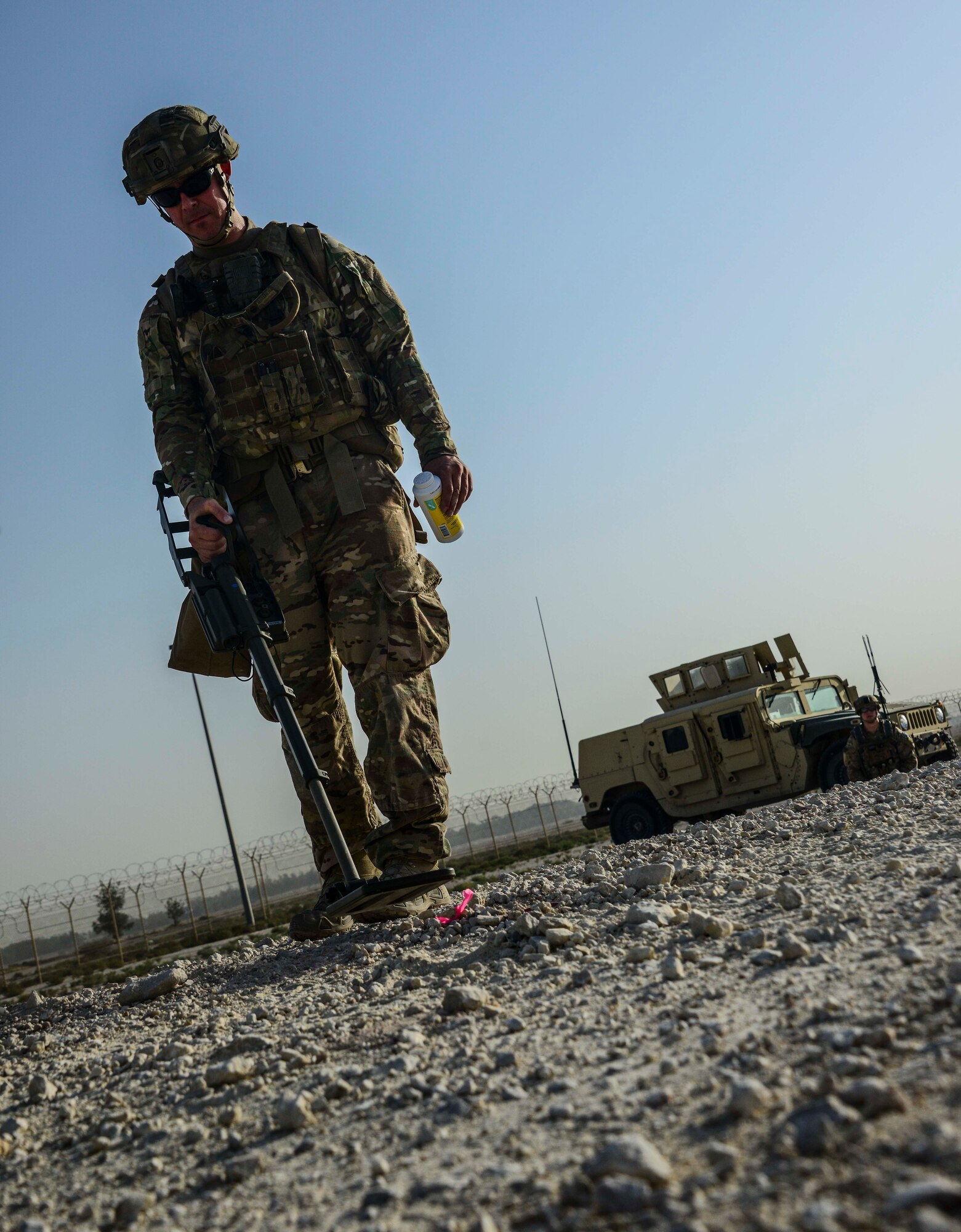 Tech. Sgt. Kelly Badger, 379th Expeditionary Civil Engineer Squadron explosive ordnance disposal craftsman, uses a compact metal detector to interrogate an improvised explosive device he detected during a training exercise May 19, 2016, at Al Udeid Air Base, Qatar. Badger said he chose to join the U.S. Air Force and EOD flight to save lives, even if it meant putting his own at risk. (U.S. Air Force photo/Senior Airman Janelle Patiño/Released) 