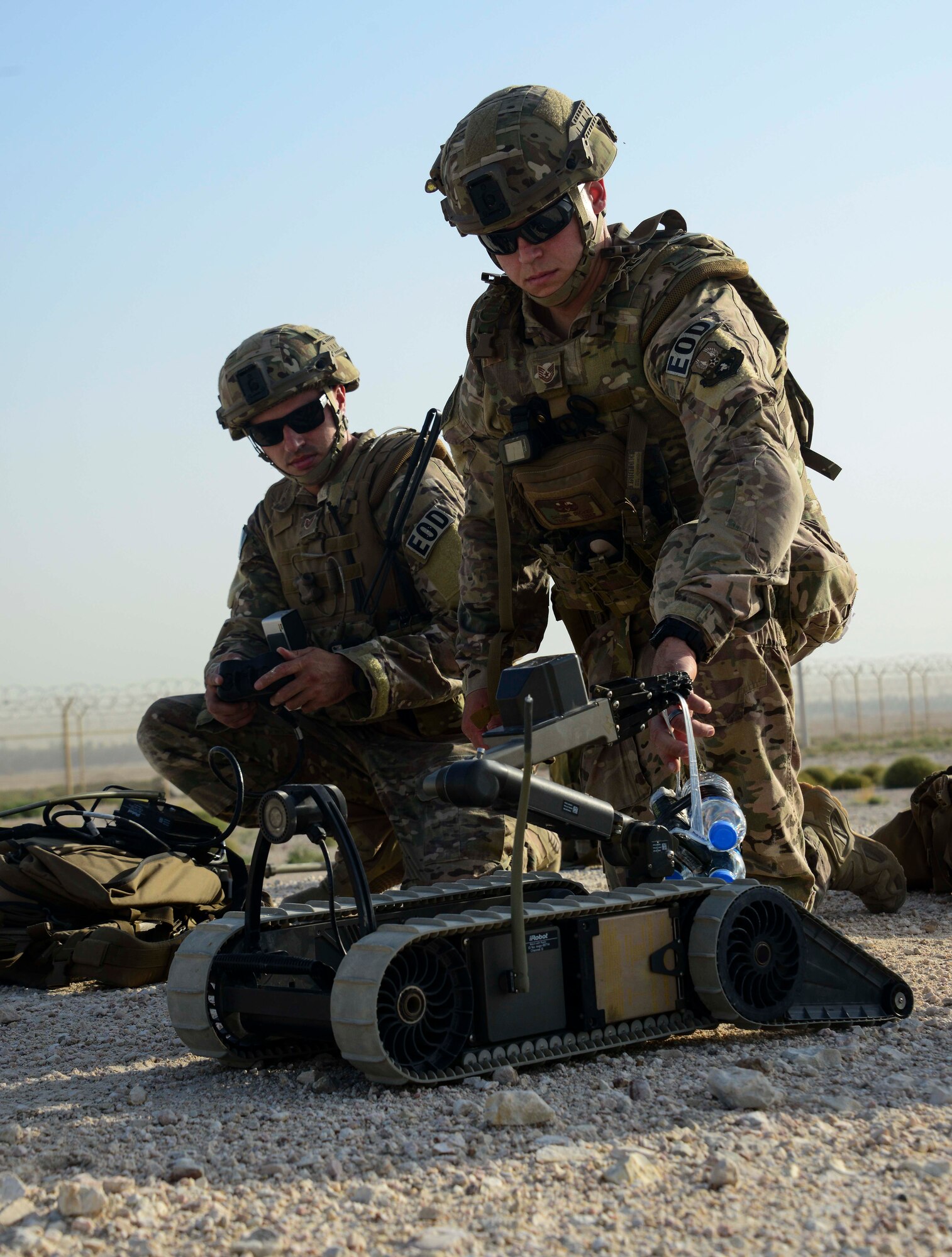 Tech Sgt. David Dickey and Staff Sgt. Darrel Linkus, both 379th Expeditionary Civil Engineer Squadron explosive ordnance disposal craftsmen, prepare to send the Pacbot 310 robot down to the location of an improvised explosive device during a training exercise May 19, 2016, at Al Udeid Air Base, Qatar. EOD Airmen are trained to detect, disarm, detonate and dispose of explosive threats all over the world. (U.S. Air Force photo/Senior Airman Janelle Patiño/Released)