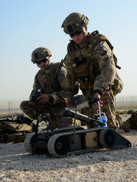 Tech Sgt. David Dickey and Staff Sgt. Darrel Linkus, both 379th Expeditionary Civil Engineer Squadron explosive ordnance disposal craftsmen, prepare to send the Pacbot 310 robot down to the location of an improvised explosive device during a training exercise May 19, 2016, at Al Udeid Air Base, Qatar. EOD Airmen are trained to detect, disarm, detonate and dispose of explosive threats all over the world. (U.S. Air Force photo/Senior Airman Janelle Patiño/Released)