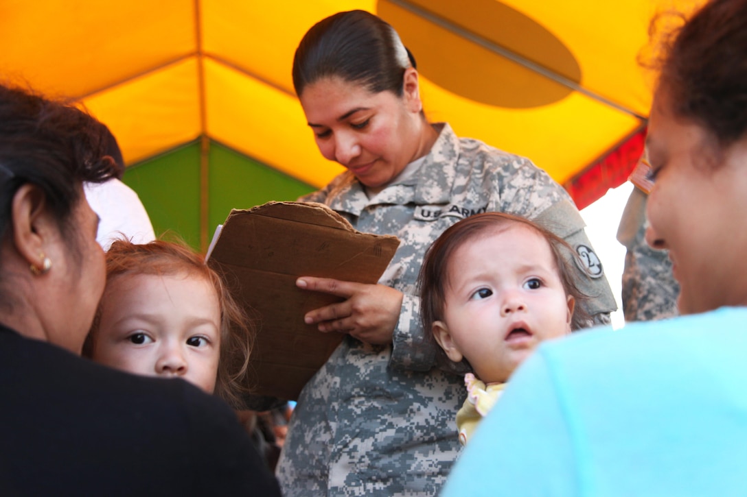 Army Sgt. 1st Class Aleya Robleto, center, checks patients in for medical care during Beyond the Horizon 2016 in San Padro, Guatemala, May 16, 2016. Robleto is assigned to the 20th Medical Brigade Headquarters. Beyond the Horizon is a U.S. Southern Command/U.S. Army South humanitarian and civic assistance exercise that provides construction and medical help to partner nations in Central America, South America and the Caribbean. Army photo by Spc. Kelson Brooks