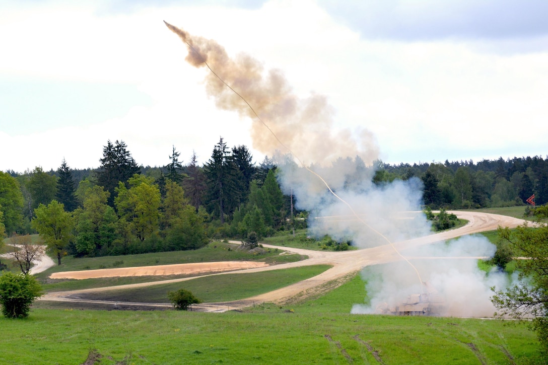 An M1 assault breacher vehicle fires a rocket to clear an obstacle during platoon proficiency testing, known as Gunnery Table XII, at Grafenwoehr Training Area, Germany, May 19, 2016. Army photo by Maj. Randy Ready