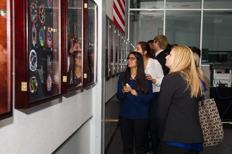 Members of the 45th Space Wing Weather Squadron met with Lake Nona High School students at Cape Canaveral Air Force Station, Fla. May 23, 2016, to discuss their Lightning Launch Commit Criteria (LLCC) findings and results in regards to weather and climatology. Prior to the school year, Bill Roeder, 45th Space Wing Weather Squadron meteorologist, reached out to the high school and introduced them to the project. The project provides students with real-world experience by following a business model of preparation, set-up, and using innovative methods to complete it. During the visit, the students also met with leadership and toured the Morrell Operations Center. (U.S. Air Force photos/Benjamin Thacker/Released) 