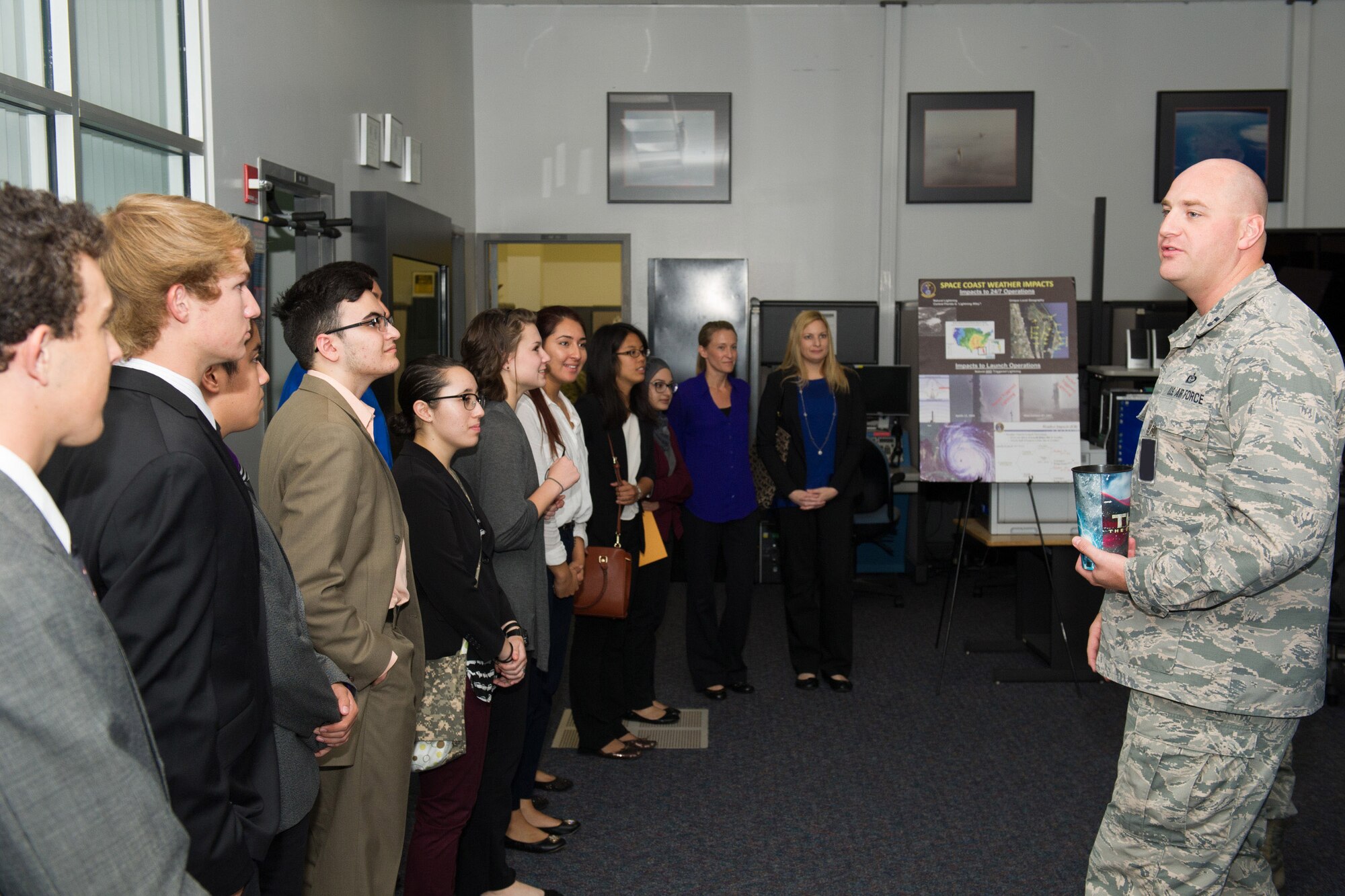 Members of the 45th Space Wing Weather Squadron met with Lake Nona High School students at Cape Canaveral Air Force Station, Fla. May 23, 2016, to discuss their Lightning Launch Commit Criteria (LLCC) findings and results in regards to weather and climatology. Prior to the school year, Bill Roeder, 45th Space Wing Weather Squadron meteorologist, reached out to the high school and introduced them to the project. The project provides students with real-world experience by following a business model of preparation, set-up, and using innovative methods to complete it. During the visit, the students also met with leadership and toured the Morrell Operations Center. (U.S. Air Force photos/Benjamin Thacker/Released) 