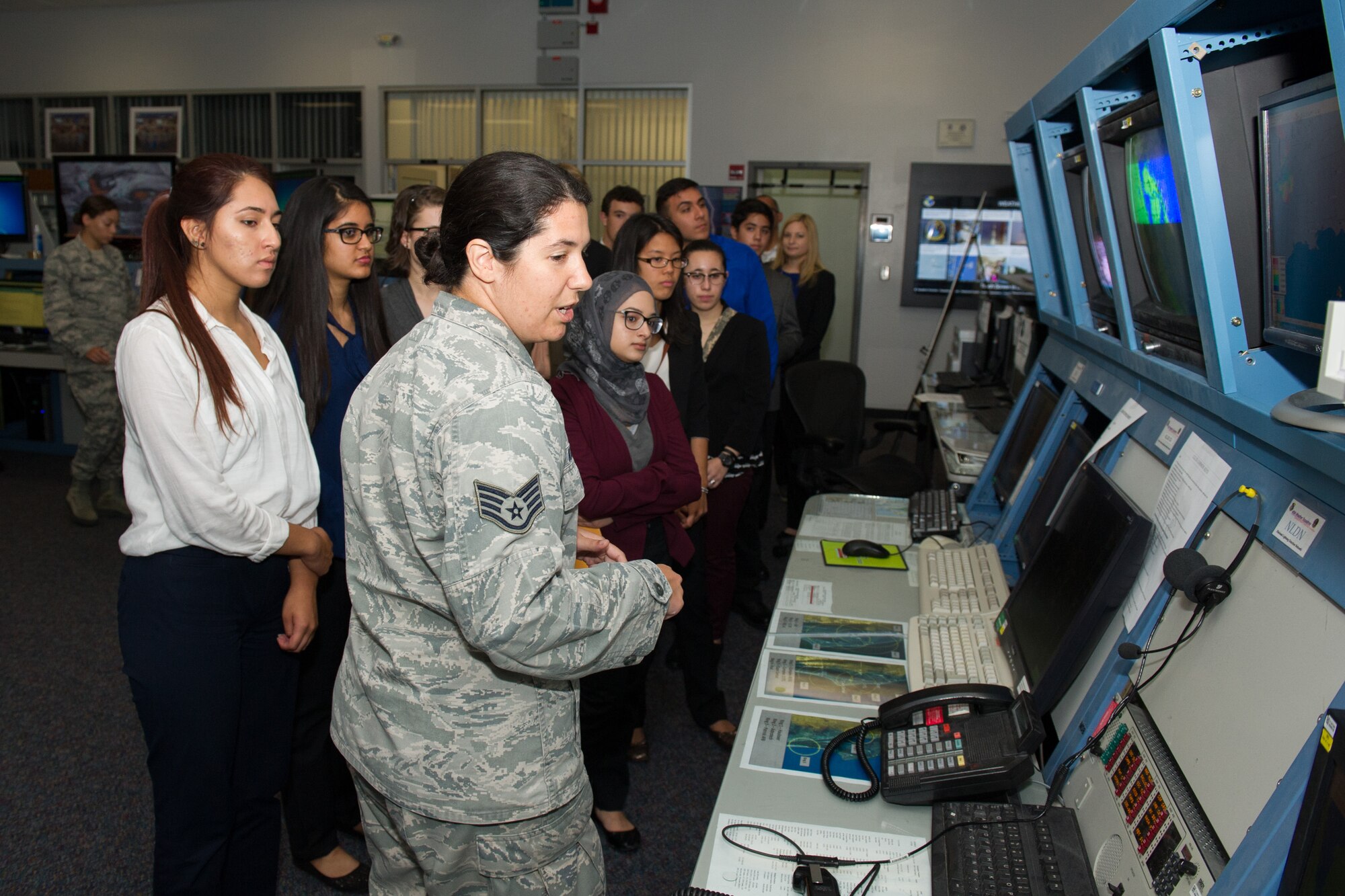 Members of the 45th Space Wing Weather Squadron met with Lake Nona High School students at Cape Canaveral Air Force Station, Fla. May 23, 2016, to discuss their Lightning Launch Commit Criteria (LLCC) findings and results in regards to weather and climatology. Prior to the school year, Bill Roeder, 45th Space Wing Weather Squadron meteorologist, reached out to the high school and introduced them to the project. The project provides students with real-world experience by following a business model of preparation, set-up, and using innovative methods to complete it. During the visit, the students also met with leadership and toured the Morrell Operations Center. (U.S. Air Force photos/Benjamin Thacker/Released) 