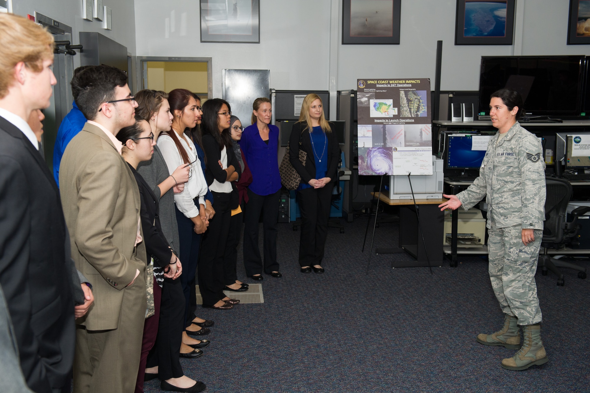 Members of the 45th Space Wing Weather Squadron met with Lake Nona High School students at Cape Canaveral Air Force Station, Fla. May 23, 2016, to discuss their Lightning Launch Commit Criteria (LLCC) findings and results in regards to weather and climatology. Prior to the school year, Bill Roeder, 45th Space Wing Weather Squadron meteorologist, reached out to the high school and introduced them to the project. The project provides students with real-world experience by following a business model of preparation, set-up, and using innovative methods to complete it. During the visit, the students also met with leadership and toured the Morrell Operations Center. (U.S. Air Force photos/Benjamin Thacker/Released) 