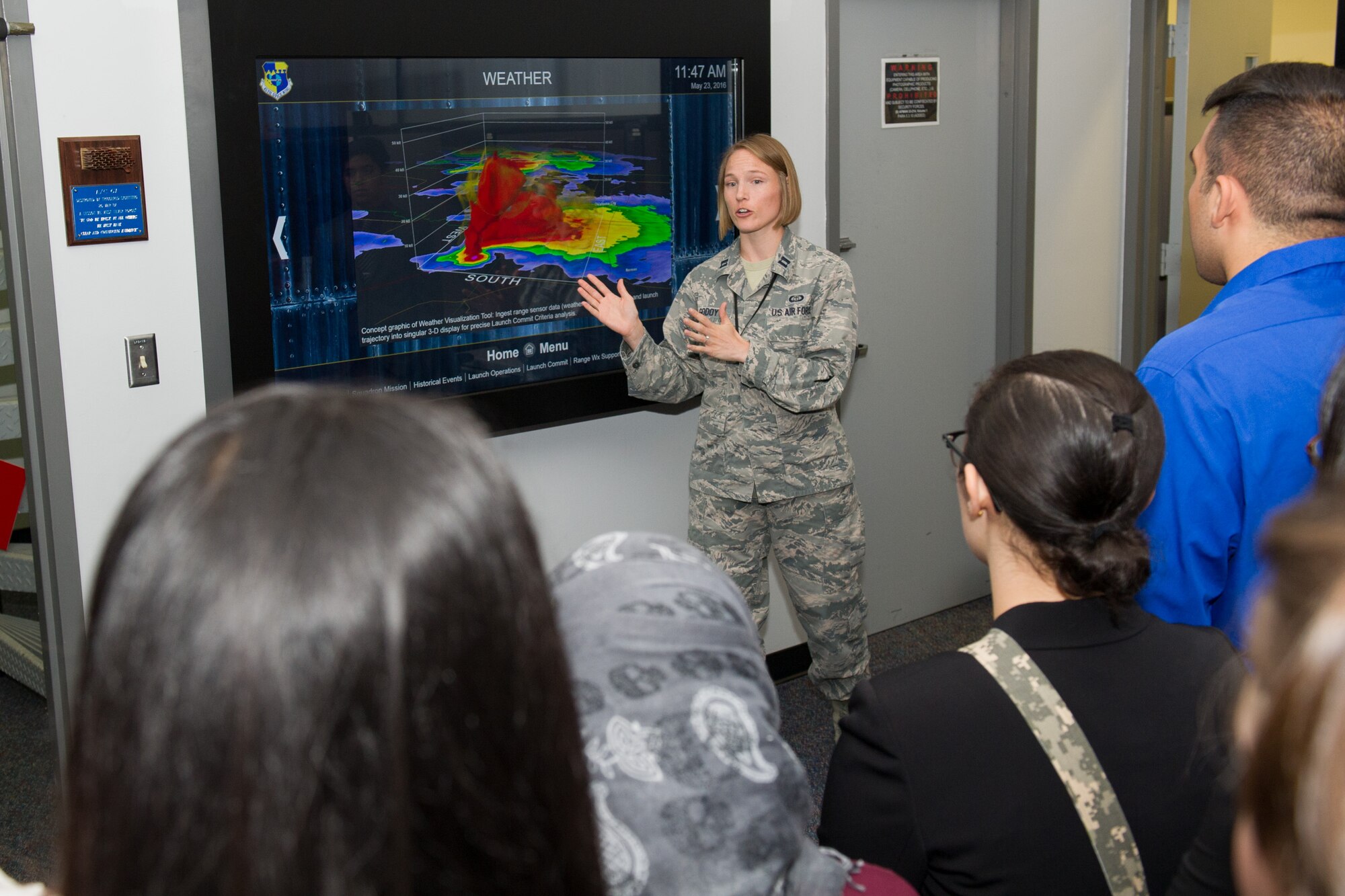 Members of the 45th Space Wing Weather Squadron met with Lake Nona High School students at Cape Canaveral Air Force Station, Fla. May 23, 2016, to discuss their Lightning Launch Commit Criteria (LLCC) findings and results in regards to weather and climatology. Prior to the school year, Bill Roeder, 45th Space Wing Weather Squadron meteorologist, reached out to the high school and introduced them to the project. The project provides students with real-world experience by following a business model of preparation, set-up, and using innovative methods to complete it. During the visit, the students also met with leadership and toured the Morrell Operations Center. (U.S. Air Force photos/Benjamin Thacker/Released) 