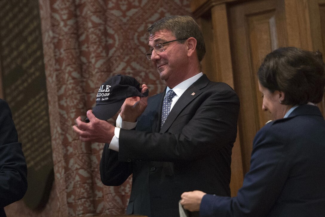 Defense Secretary Ash Carter shows off a Yale Air Force ROTC hat that was presented to him after he delivered remarks at a commissioning ceremony at Yale University in New Haven, Conn., May 23, 2016. DoD photo by Air Force Senior Master Sgt. Adrian Cadiz 