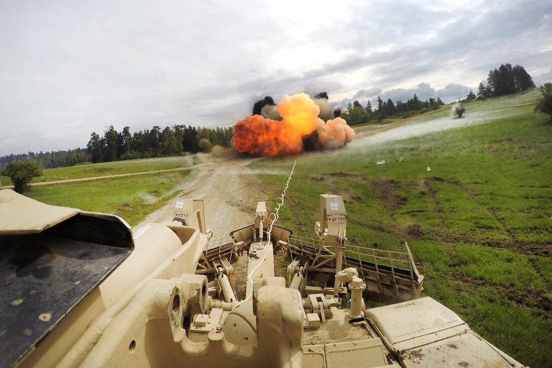 Soldiers detonate a mine clearing line charge to clear an obstacle during Gunnery Table XII at Grafenwoehr Training Area, Germany, May 19, 2016. Army photo by Maj. Randy Ready