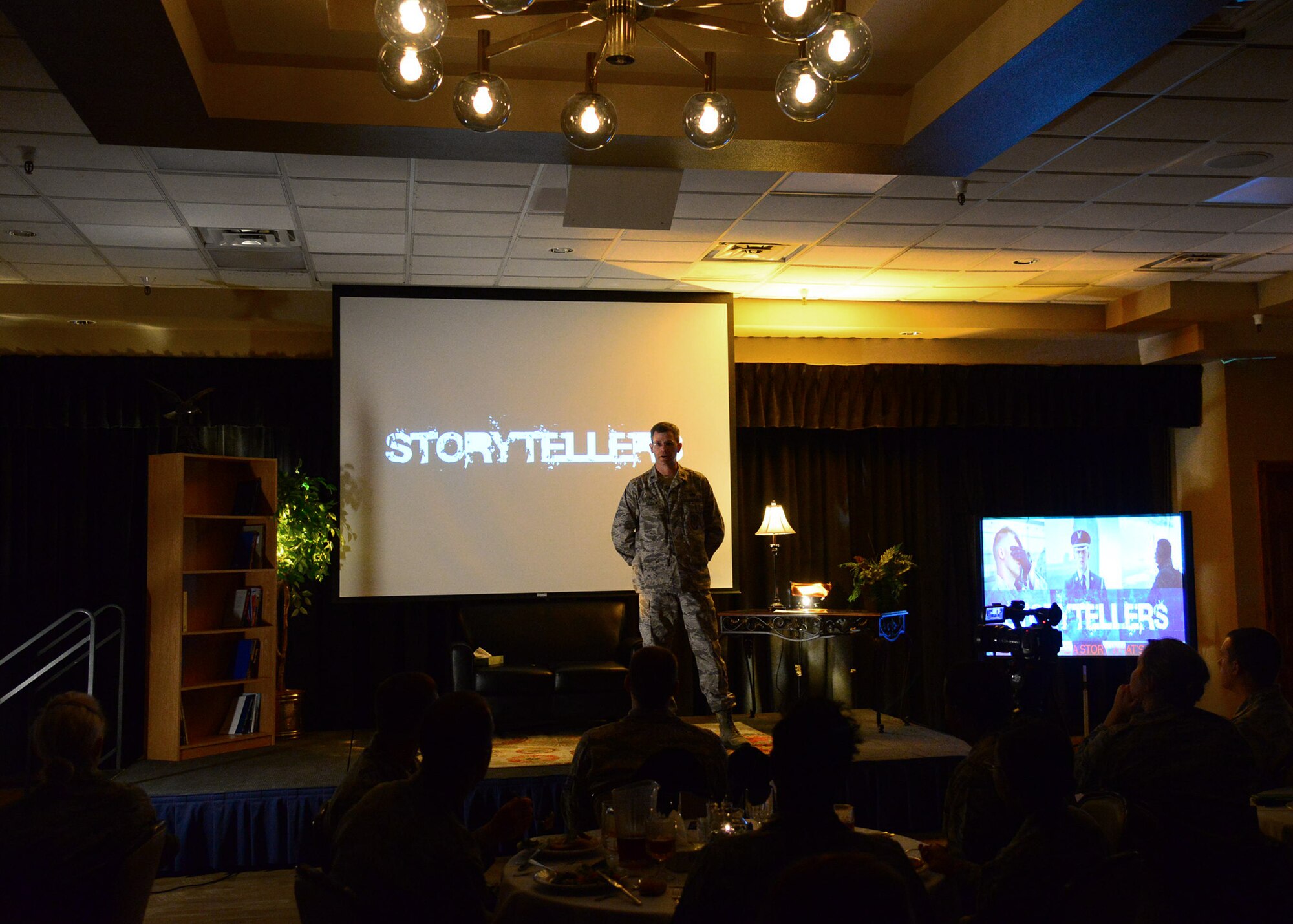Lt. Col. Joel Sloan, 27th Special Operations Civil Engineer Squadron commander, retells the heartbreaking story of his and his wife’s struggle with the loss of three children to spinal muscular atrophy during the third Storytellers event May 20, 2016, at Cannon Air Force Base, N.M. Storytellers was created to inspire resiliency within teammates and wingmen. (U.S. Air Force photo/Senior Airman Chip Slack)