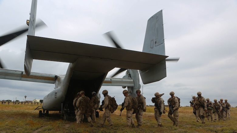 Marines with the 11th Marine Expeditionary Unit board an MV-22B Osprey with Marine Medium Tiltrotor Squadron163 (Reinforced) during a simulated raid on Marine Corps Base Camp Pendleton, Calif., May 17. Marines with VMM-163 (Rein.) supplied four MV-22B Ospreys, two AH-1W Cobras, two UH-1Y Hueys and one CH-53E Super Stallion to support the training. 