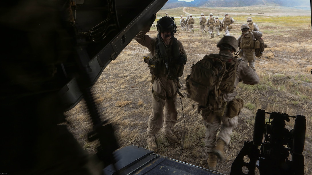 Marines with the 11th Marine Expeditionary Unit exit an MV-22B Osprey with Marine Medium Tiltrotor Squadron 163 (Reinforced) to their objective point during a simulated raid on Marine Corps Base Camp Pendleton, Calif., May 17. Marines with VMM-163 (Rein.) supplied four MV-22B Ospreys, two AH-1W Cobras, two UH-1Y Hueys and one CH-53E Super Stallion to support a simulated raid. 