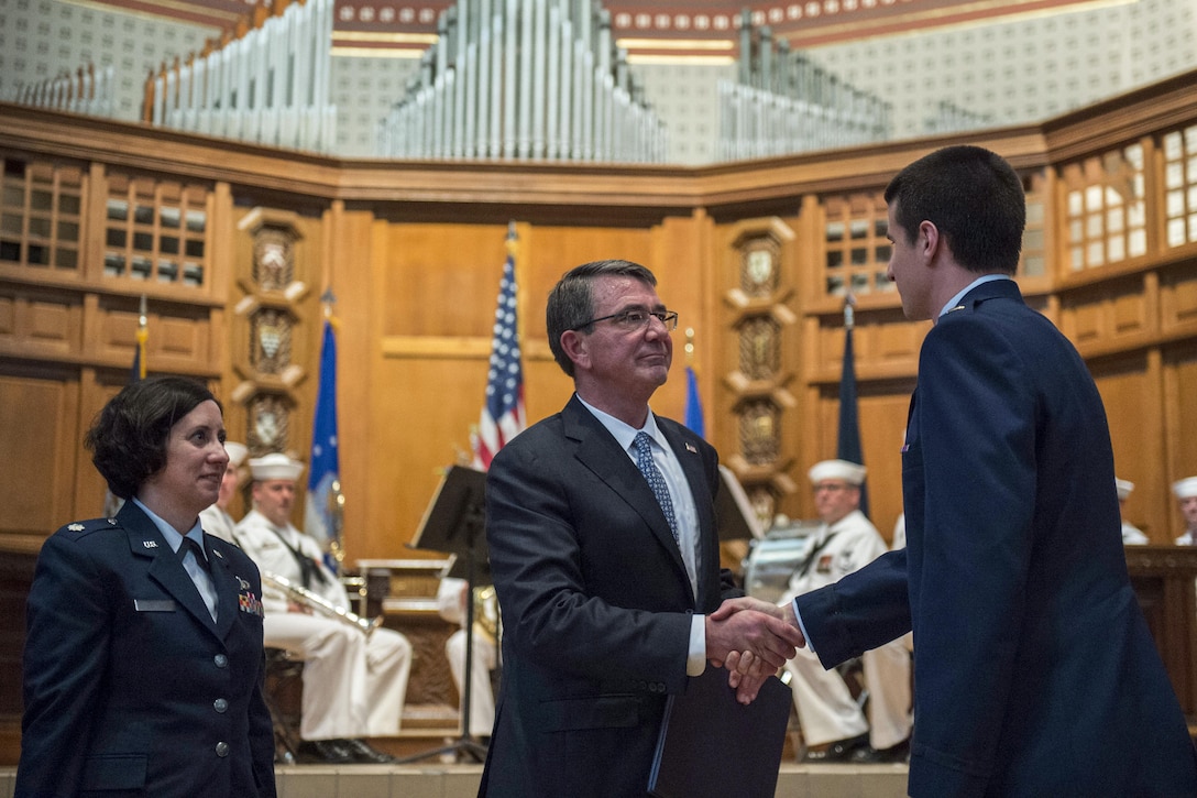 Defense Secretary Ash Carter congratulates a newly commissioned Air Force second lieutenant after administering the oath of office to Air Force and Navy ROTC students during a commissioning ceremony at Yale University in New Haven, Conn., May 23, 2016. DoD photo by Air Force Senior Master Sgt. Adrian Cadiz