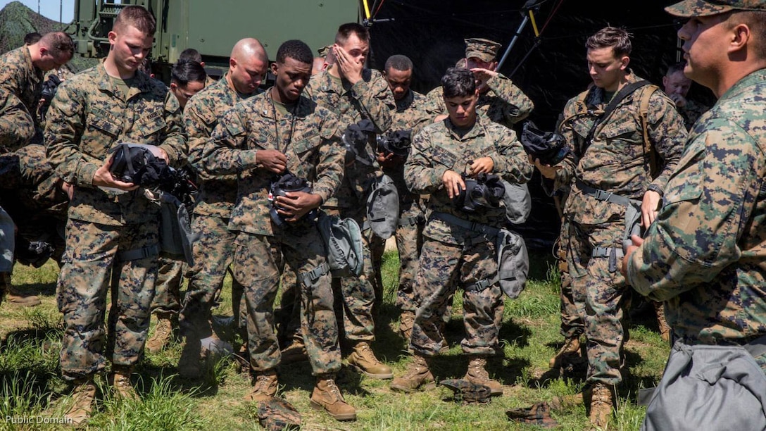 Marines with II Marine Expeditionary Force Headquarters Group receive a brief before testing their M50 gas masks in a field environment during MEFEX at Marine Corps Base Camp Lejeune, N.C., May 15, 2016. MEFEX 16 is a command and control exercise conducted in a simulated deployed environment designed to synchronize and bring to bear the full spectrum of II Marine Expeditionary Force's C2 capabilities in support of a Marine Air-Ground Task Force. Conducting exercises of this nature ensures II MEF remains ready to provide the Marine Corps with an experienced staff capable of integrating with international allies and partner nations in a combined joint task force, charged with accomplishing a wide range of military operations. 