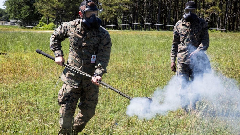Sgt. Patrick Cook, Chemical Biological Radiological Nuclear Non-Commissioned Officer with II Marine Expeditionary Force Headquarters Group, runs with tear gas during an individual protective equipment exercise during MEFEX 16 at Marine Corps Base Camp Lejeune, N.C., May 15, 2016. MEFEX 16 is a command and control exercise conducted in a simulated deployed environment designed to synchronize and bring to bear the full spectrum of II Marine Expeditionary Force's C2 capabilities in support of a Marine Air-Ground Task Force. Conducting exercises of this nature endures II MEF remains ready to the Marine Corps with an experienced staff capable of integrating with international allies and partner nations in a combined joint task force, charged with accomplishing a wide range of military operations. (U.S. Marine Corps photo by Sgt. Kirstin Merrimarahajara/released)