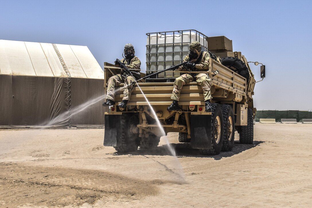 U.S. Army Reserve soldiers with the 369th Chemical Company perform chemical, biological, radiological and nuclear operations in full chemical gear at Camp Arifjan, Kuwait, May 18, 2016. (U.S. Army photo by Sgt. 1st Class Marisol Walker)