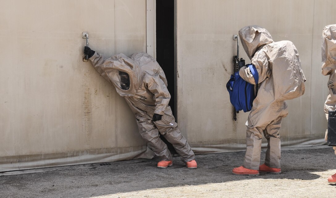 U.S. Army Reserve soldiers with the 369th Chemical Company perform chemical, biological, radiological and nuclear operations in full chemical gear at Camp Arifjan, Kuwait, May 18, 2016. (U.S. Army photo by Sgt. 1st Class Marisol Walker)