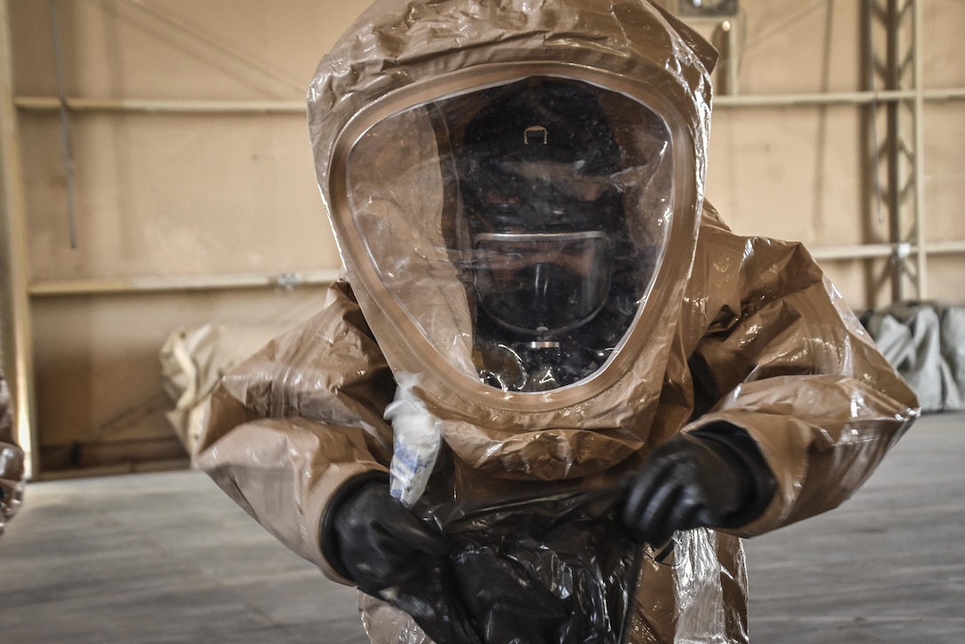 A U.S. Army Reserve soldiers with the 369th Chemical Company performs chemical, biological, radiological and nuclear operations in full chemical gear at Camp Arifjan, Kuwait, May 18, 2016. (U.S. Army photo by Sgt. 1st Class Marisol Walker)