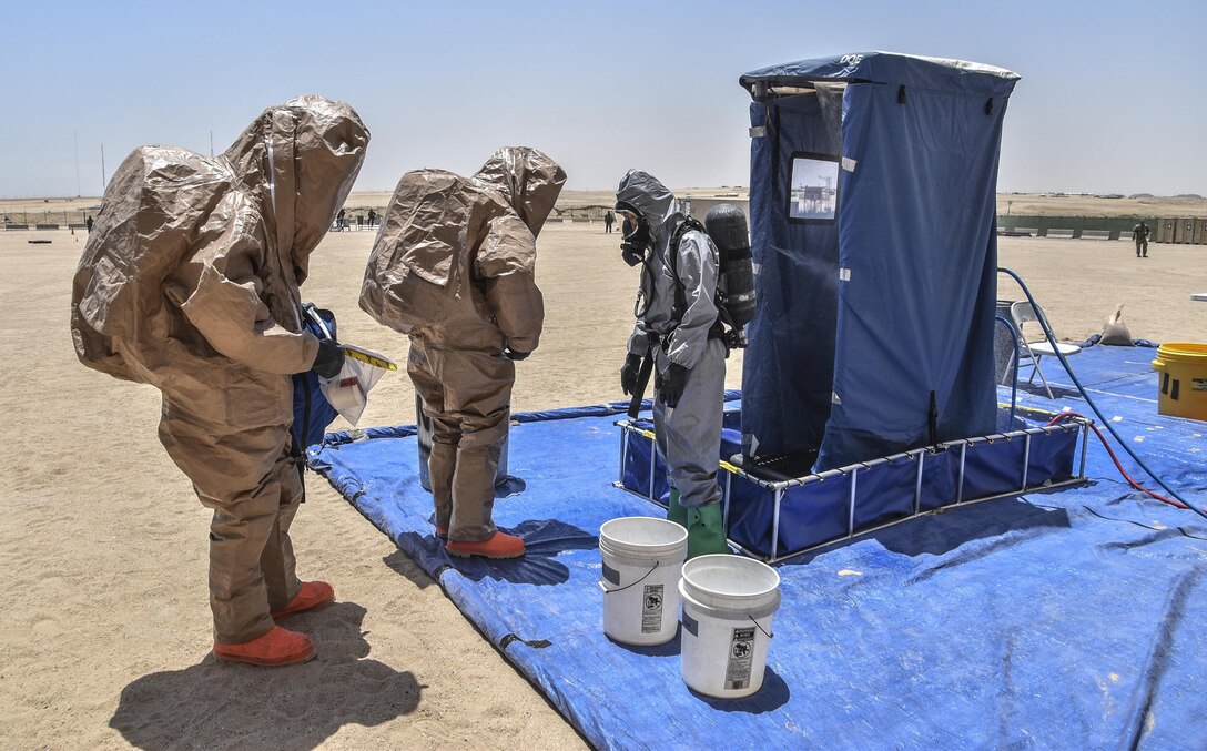 U.S. Army Reserve soldiers with the 369th Chemical Company perform chemical, biological, radiological and nuclear operations in full chemical gear at Camp Arifjan, Kuwait, May 18, 2016.