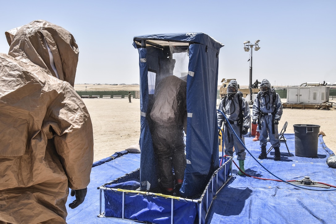 U.S. Army Reserve soldiers with the 369th Chemical Company perform chemical, biological, radiological and nuclear operations in full chemical gear at Camp Arifjan, Kuwait, May 18, 2016. (U.S. Army photo by Sgt. 1st Class Marisol Walker)