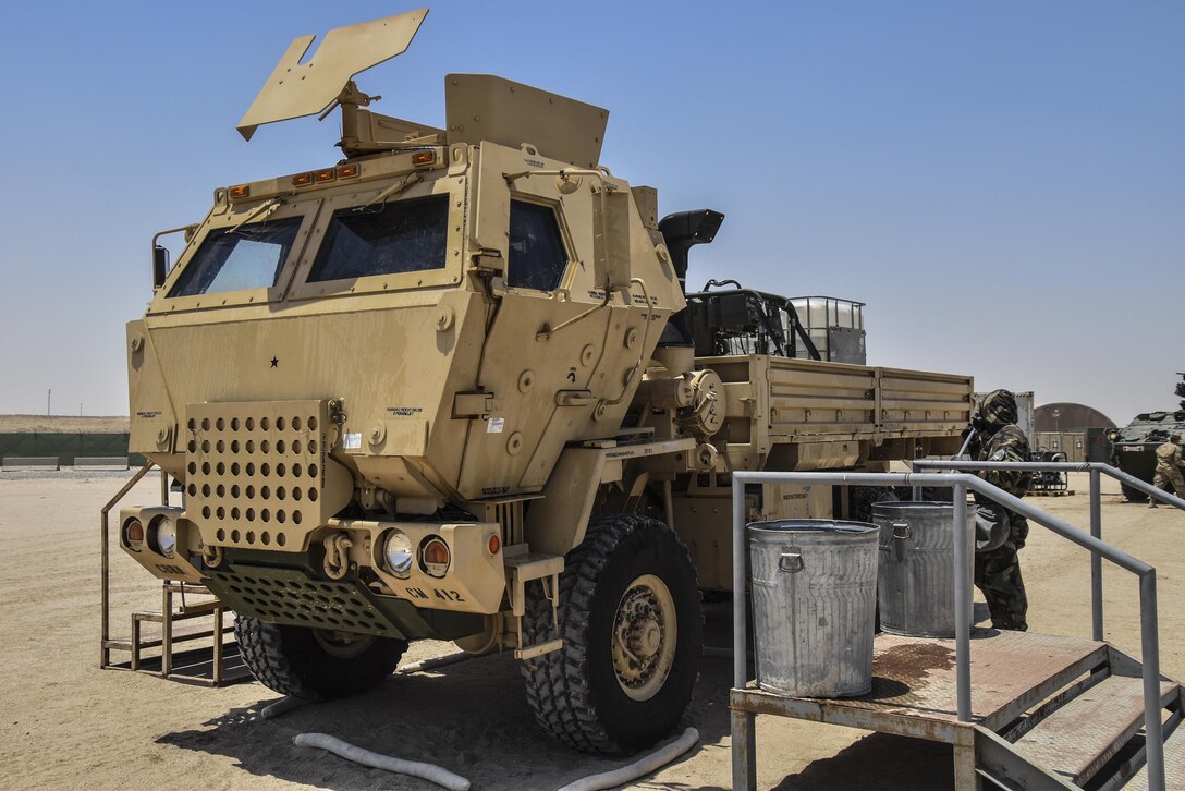 A U.S. Army Reserve soldier with the 369th Chemical Company performs chemical, biological, radiological and nuclear operations in full chemical gear at Camp Arifjan, Kuwait, May 18, 2016. (U.S. Army photo by Sgt. 1st Class Marisol Walker)