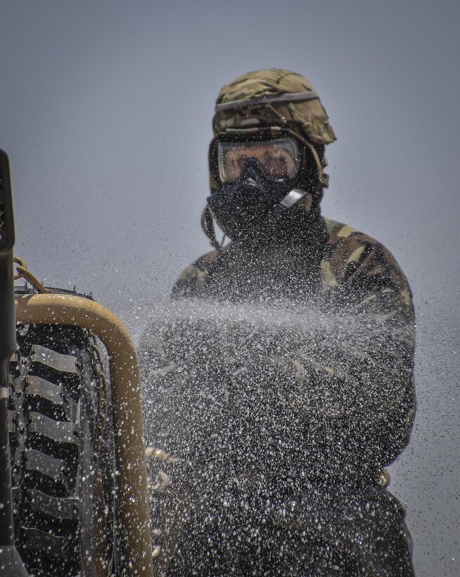 A U.S. Army Reserve soldier with the 369th Chemical Company performs chemical, biological, radiological and nuclear operations in full chemical gear at Camp Arifjan, Kuwait, May 18, 2016. (U.S. Army photo by Sgt. 1st Class Marisol Walker)